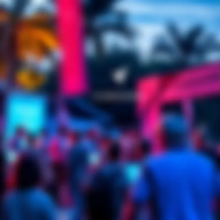 Group of people discussing Cardano in a vibrant outdoor setting with banners and laptops.