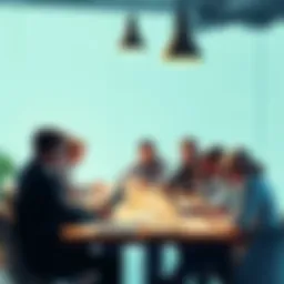 A group of people discussing news articles with papers and laptops around a table.